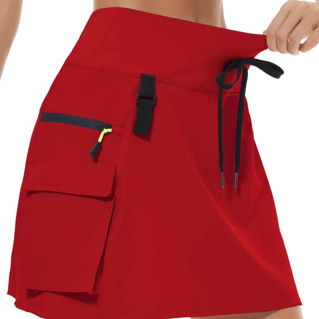 Jupe de tennis à manches rapides en polyester à vente chaude pour femmes avec une taille élastique et des poches zippées
