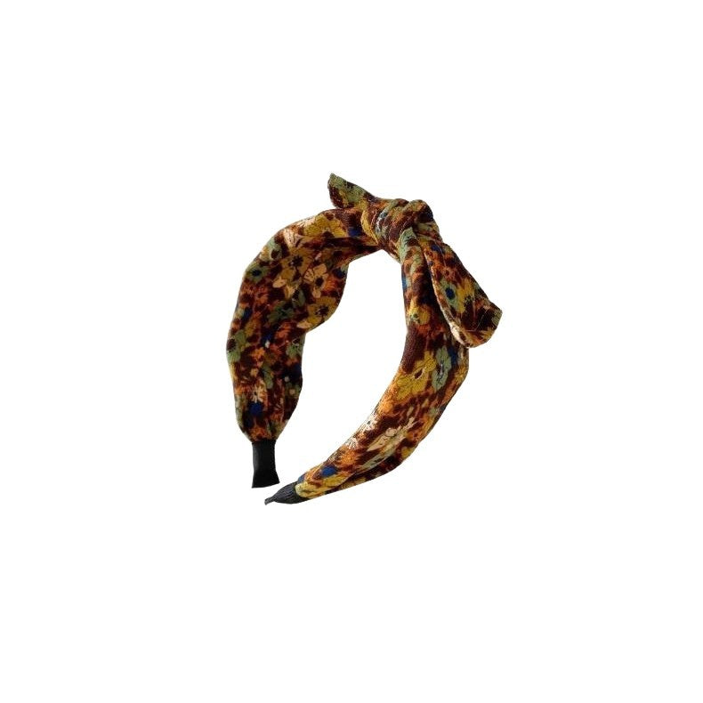 Simple bande de cheveux de tissu large bordé avec un motif imprimé et un noeud lié