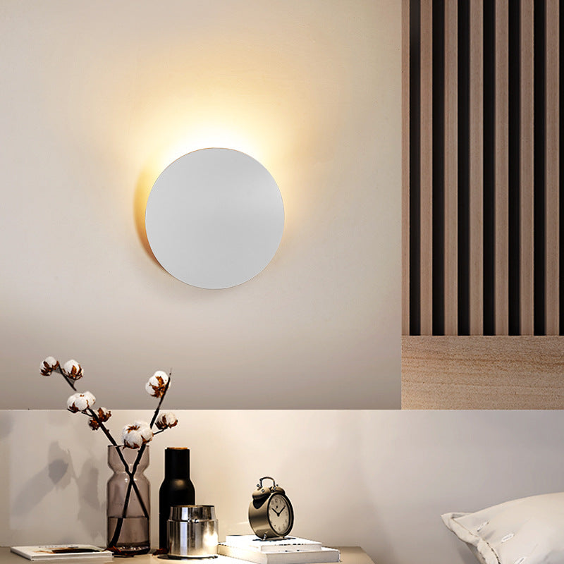 Lampe murale simple côté lit