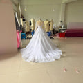 Robe de mariée à manches longues brodées