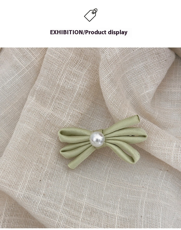 Clip latéral Bangs Pearl Bow Une paire de clips de canard