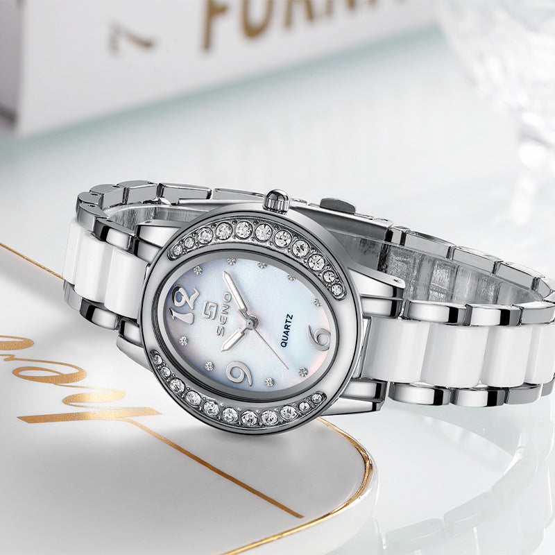 Femmes Montre élégant Oval Diamond incrusté Imperméable Quartz Montre avec une lumière Di