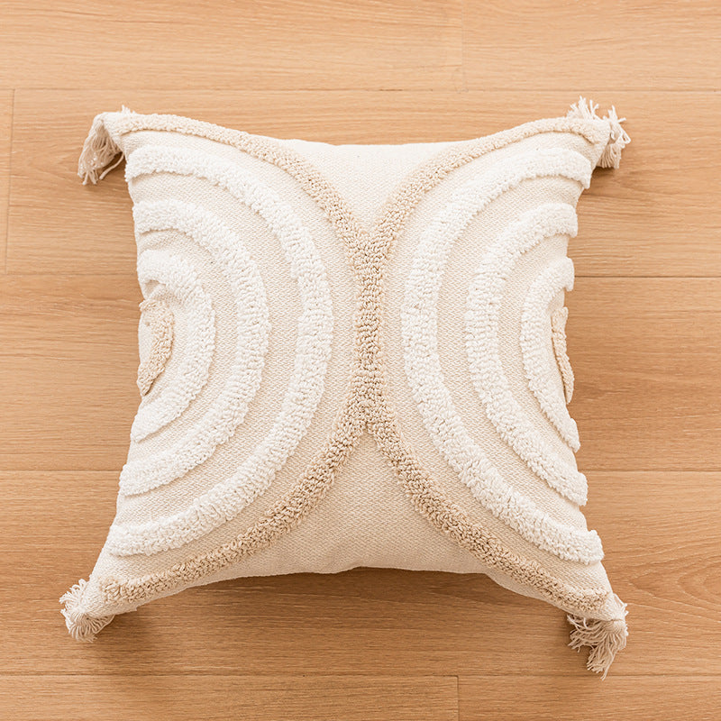 Canapé simple avec un coussin en tassel et des housses d'oreiller