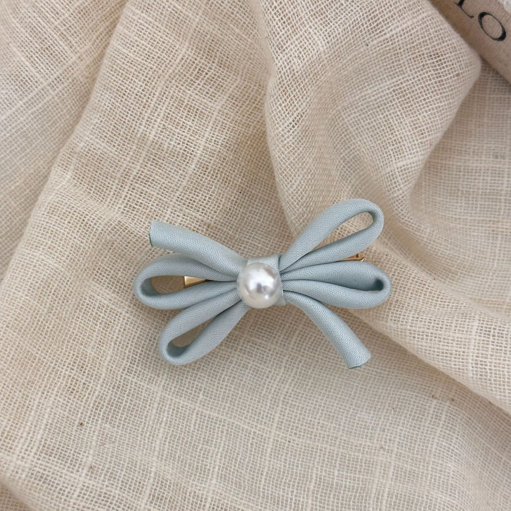 Clip latéral Bangs Pearl Bow Une paire de clips de canard