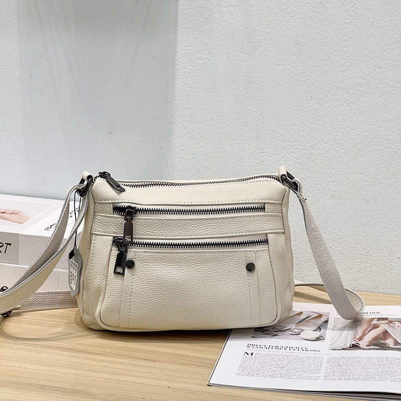 Sac à main en cuir de vache avec bande transversale en cuir véritable