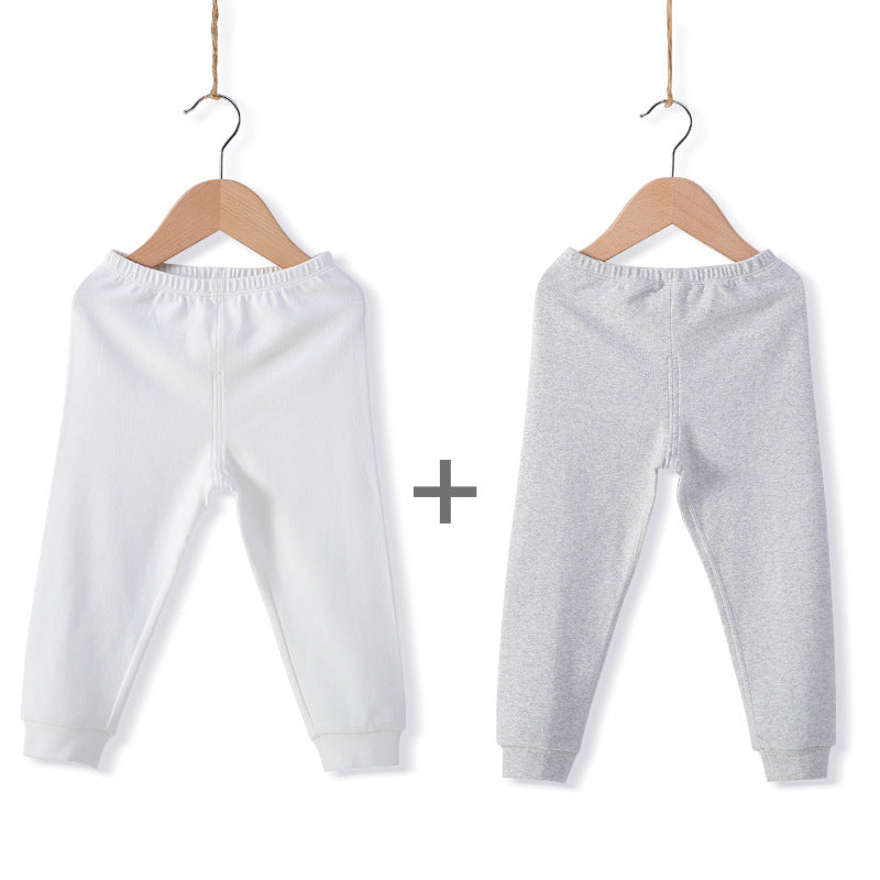 Les garçons et les filles gardent les leggings élastiques chauds