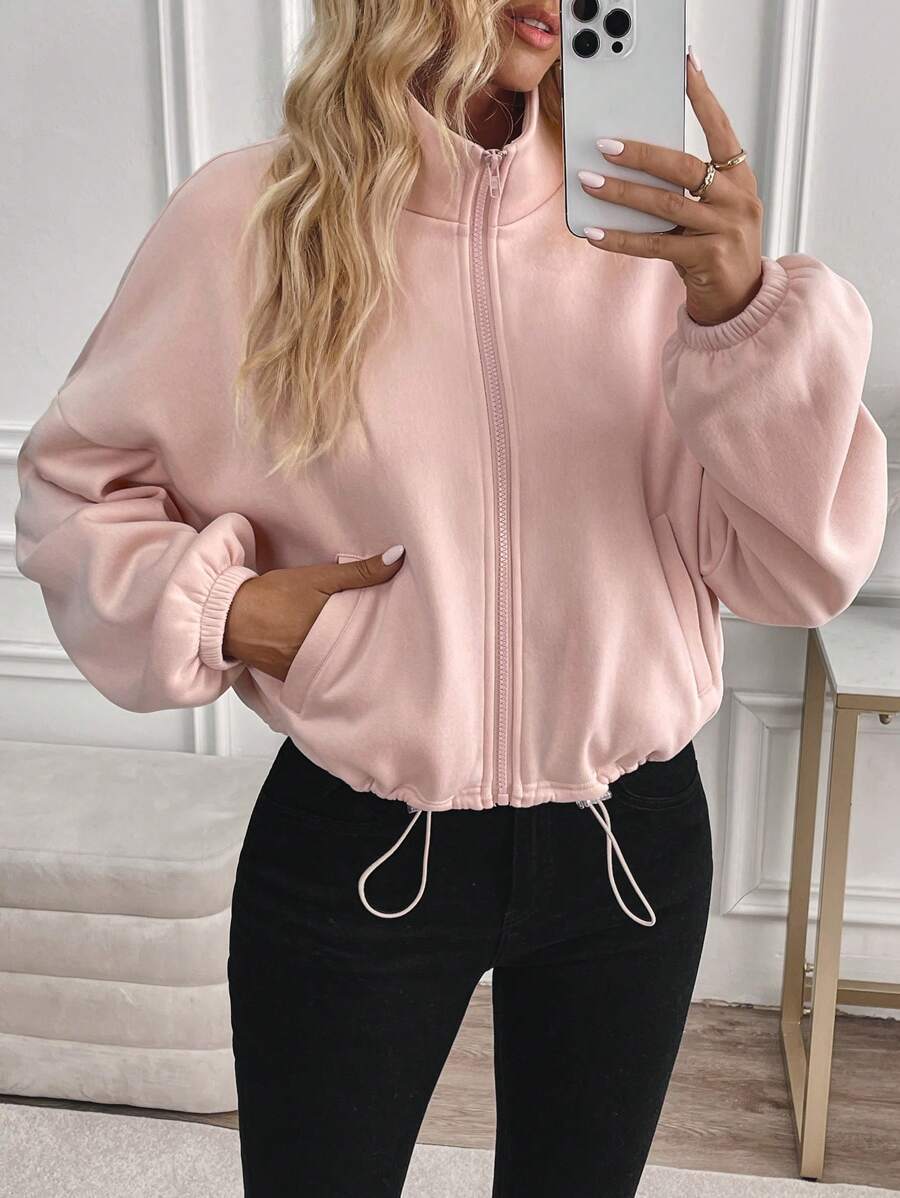 Long-sleeved jacket with drawstring and zip closure