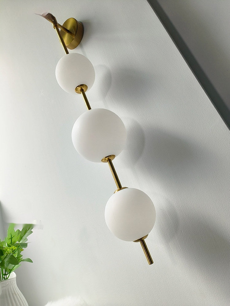Lampe murale côté lit - Lampe perle