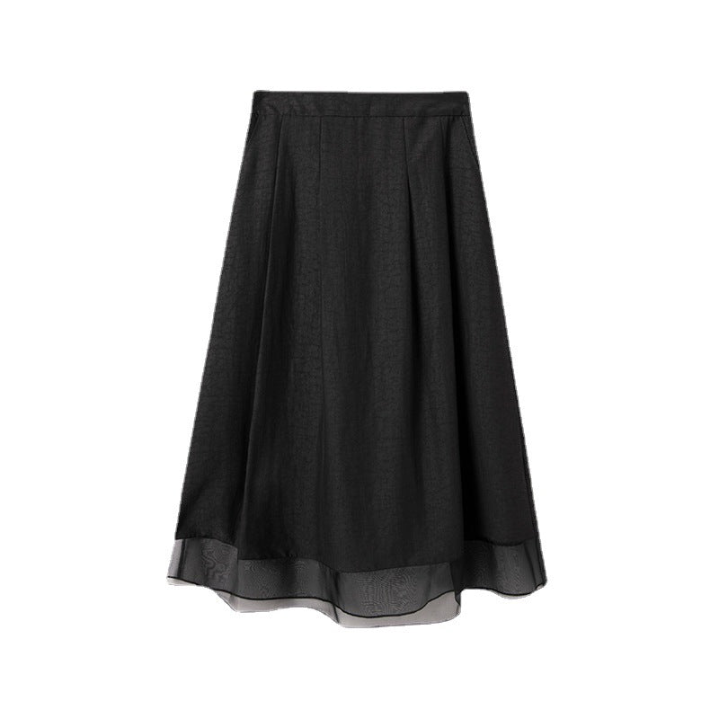 Jupe en soie noire mi-longueur courte poche élastique
