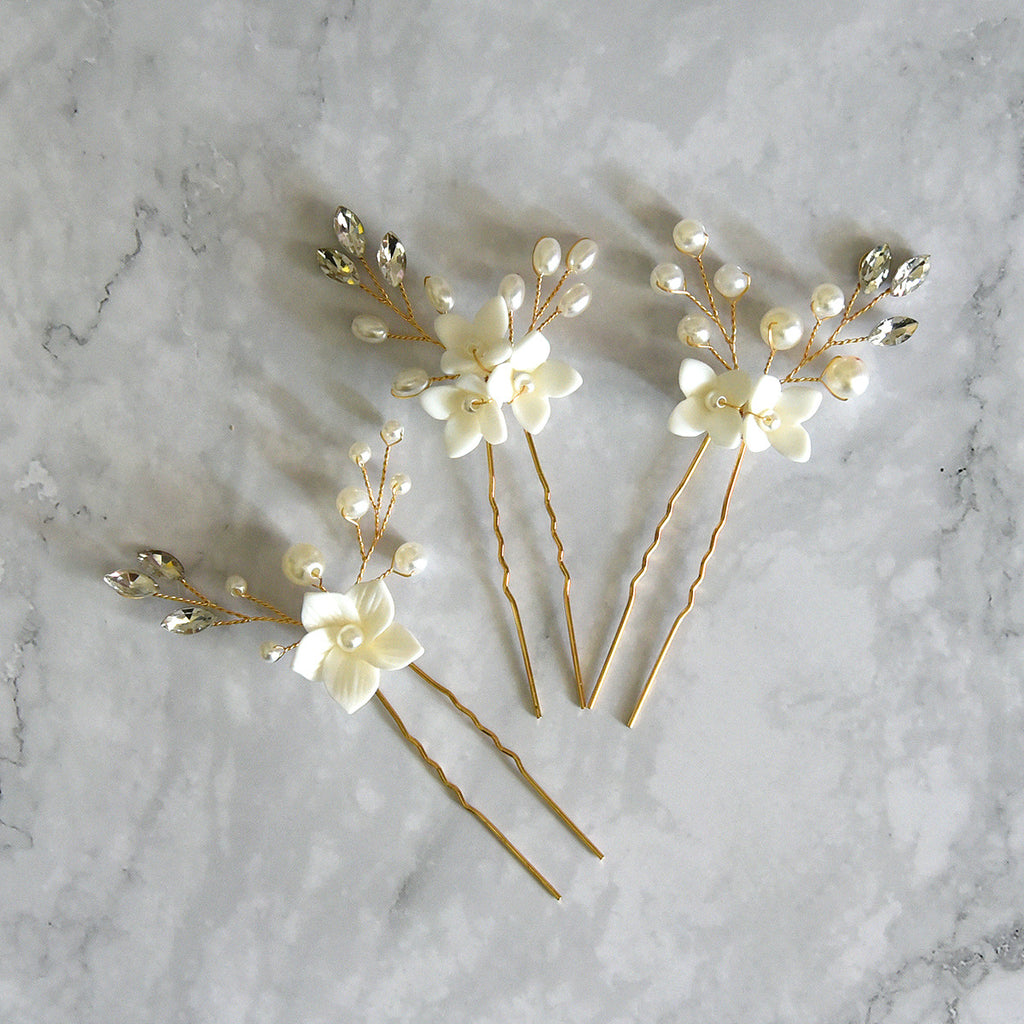 Three sets of U-shaped white flower hairpins
