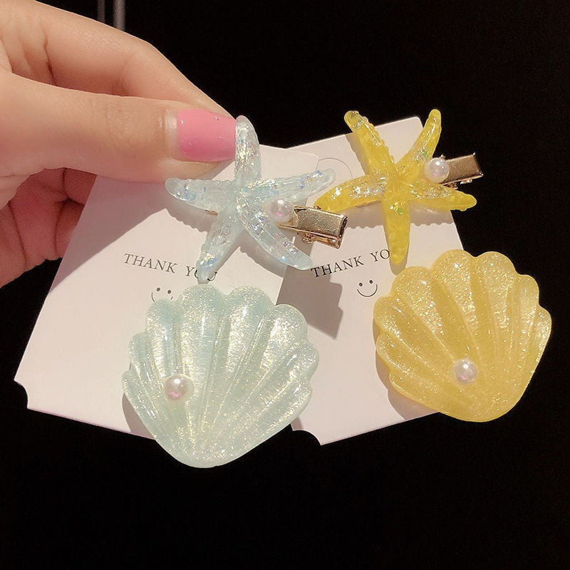 Barrettes d'étoiles de coquillage