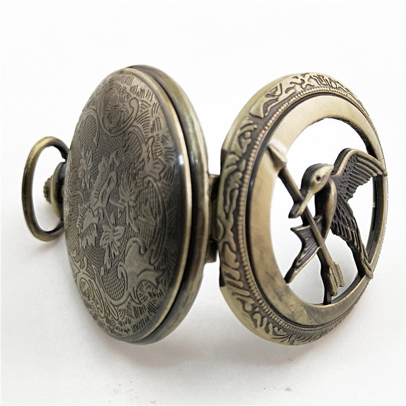 Vieille montre de poche fléchée aux gros oiseaux