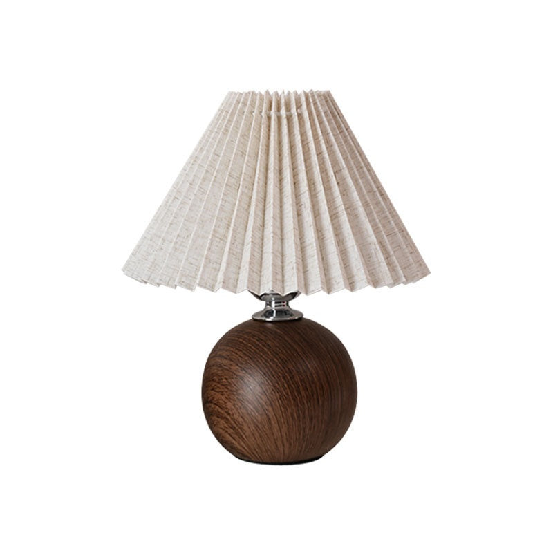 Pleated fabric table lamp with a ceramic base