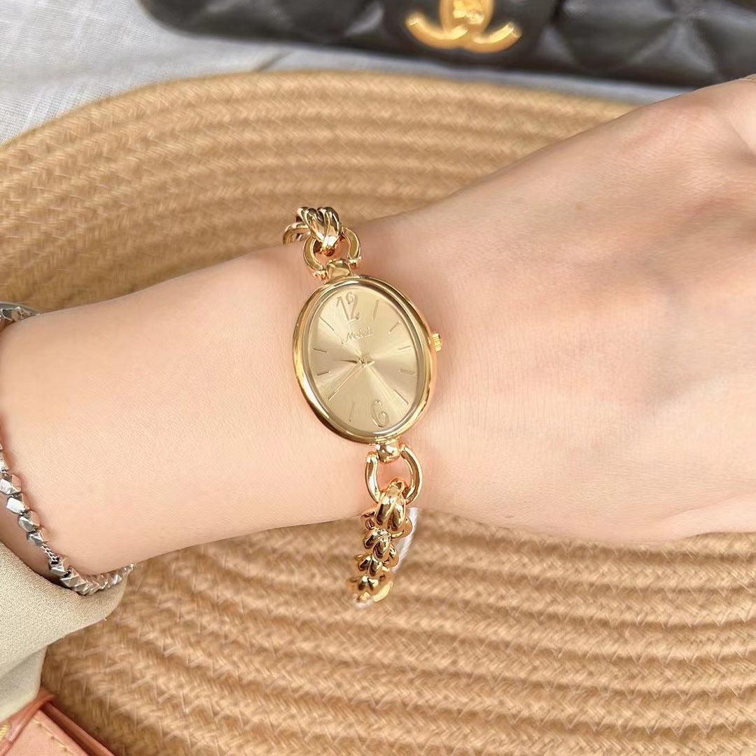 Lady's Steel Strap Watch Or Oval Hollow Chain Quartz Watch