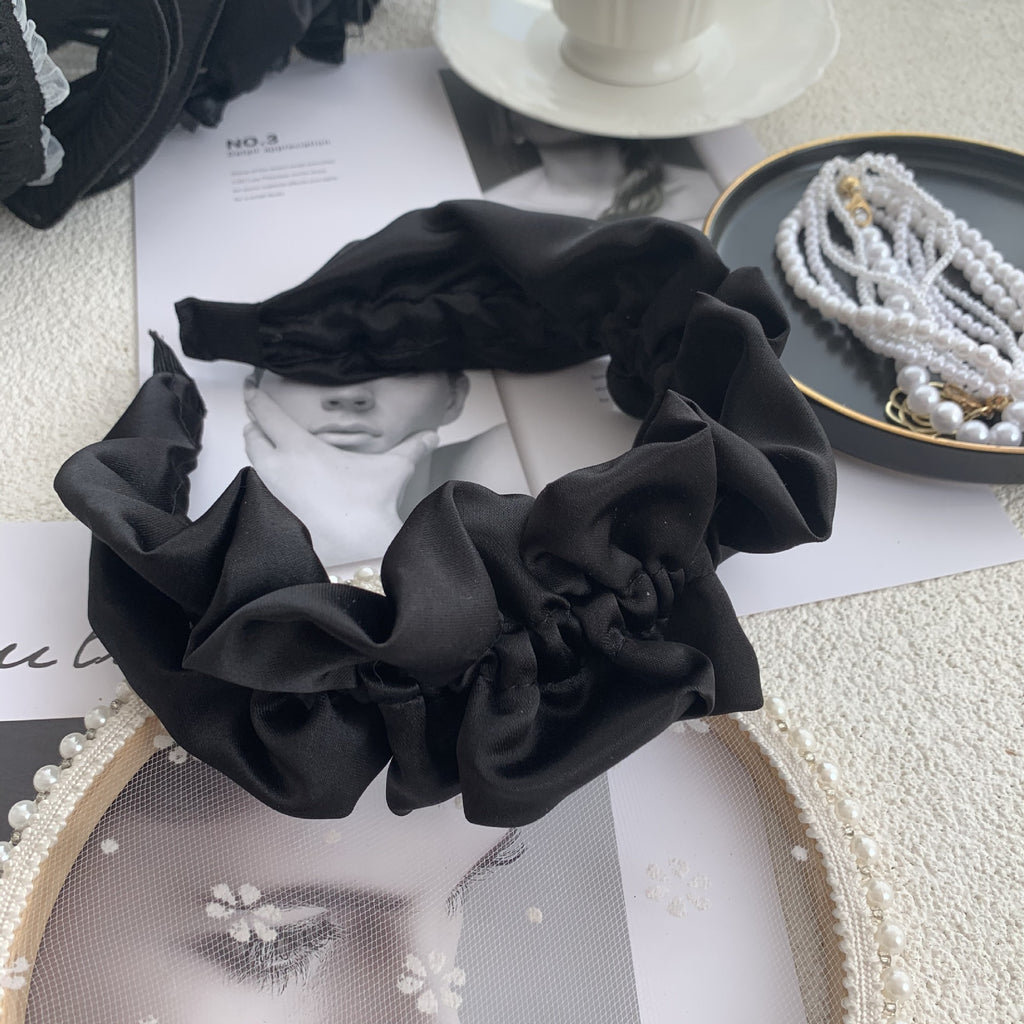 Exaggerated Black Wood Ear Hoop Hairstyle