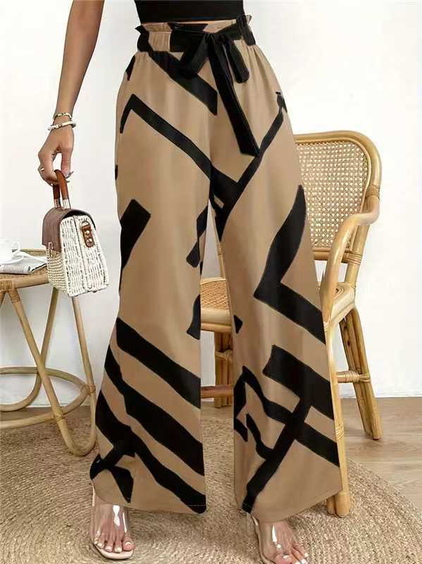 Elasticated wide-leg printed trousers with drawstring ties