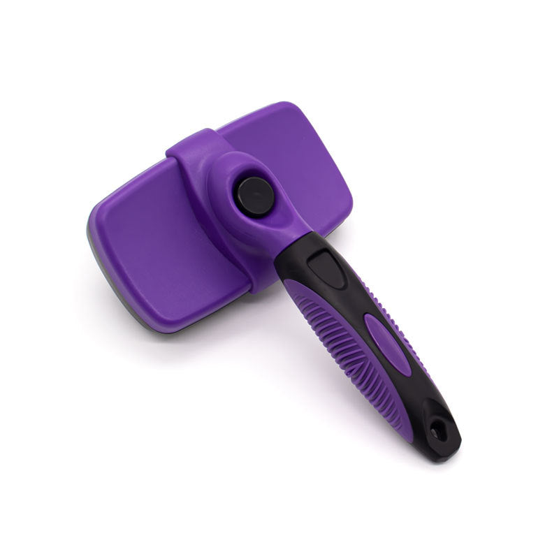 Brosse auto-nettoyante pour chien pour la couverture