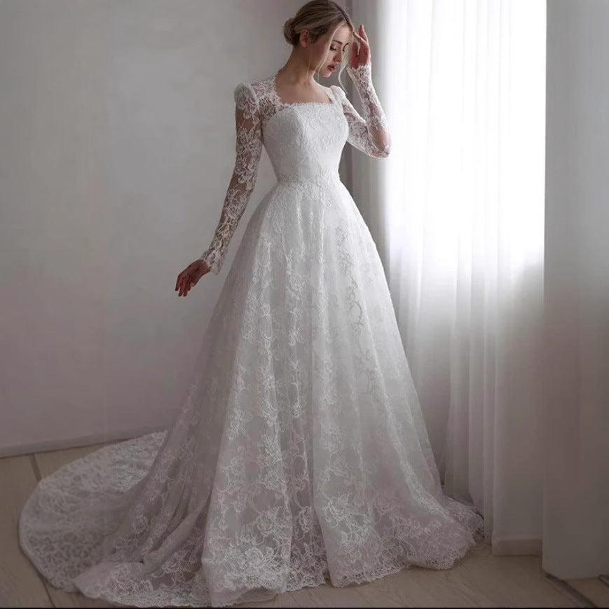 Robe de mariée à manches longues brodées