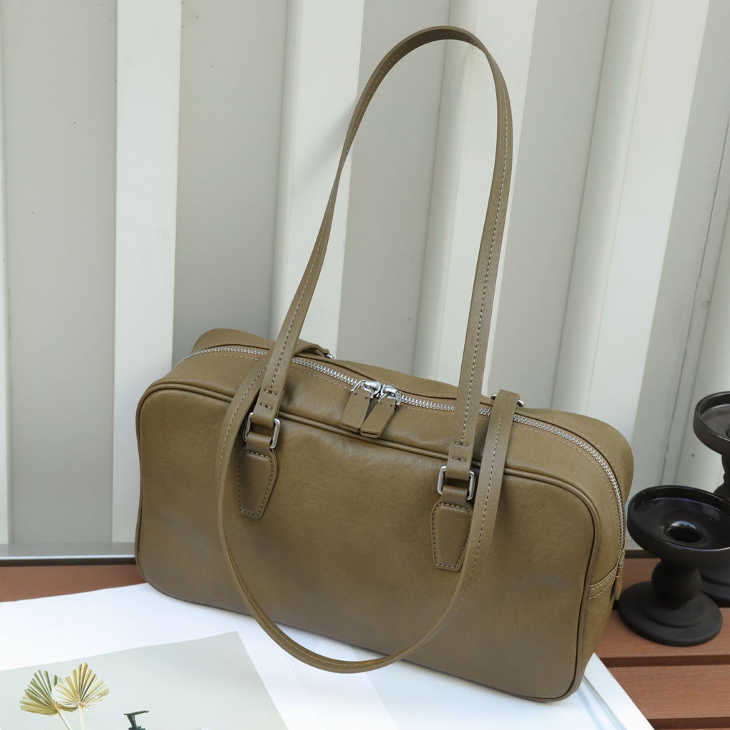 Couche de tête Cowhide sac pour femmes Armpit sac de bowling sac sac de fourre-tout Niche main en cuir haut de gamme