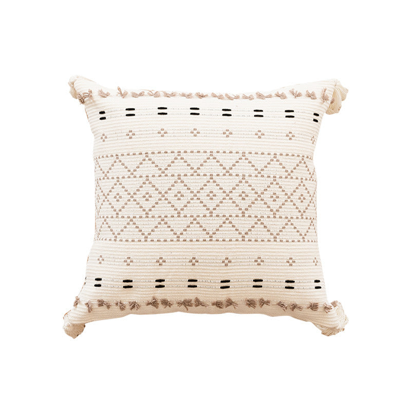 Canapé simple avec un coussin en tassel et des housses d'oreiller