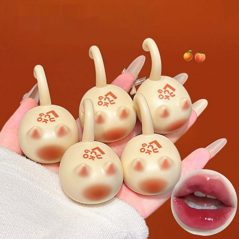 Orange Cat Lip Glaze Sheer et jeune avec une finition miroir comme Dewy