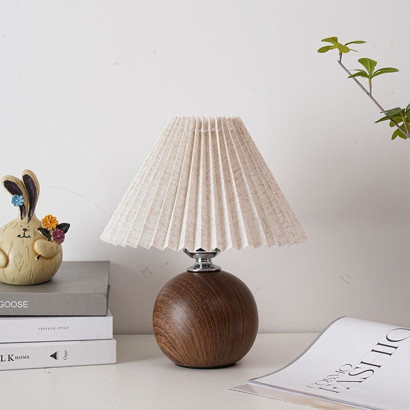 Pleated fabric table lamp with a ceramic base