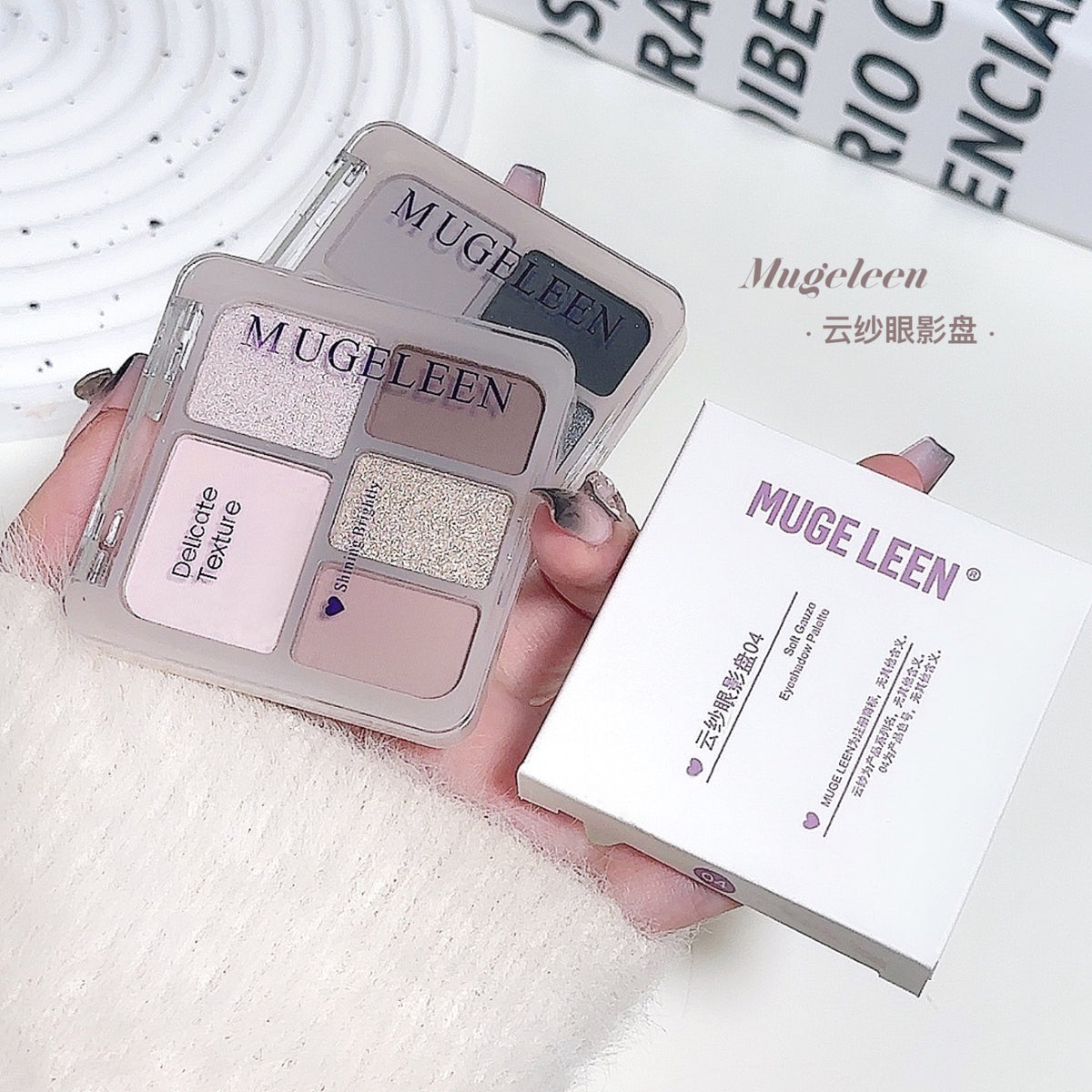 Five-color eyeshadow palette with earthy shimmer tones and matte accent shades