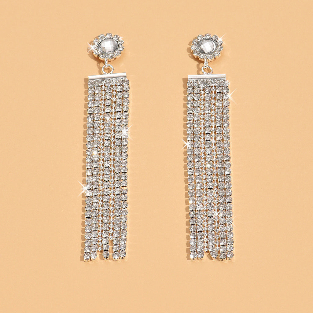 Boucles d'oreilles en strass argenté style