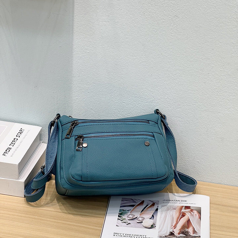Sac à main en cuir de vache avec bande transversale en cuir véritable