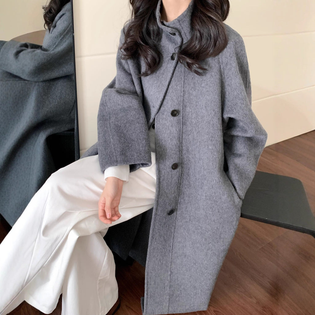 Manteau de laine longue pour femmes avec un design à un seul sein