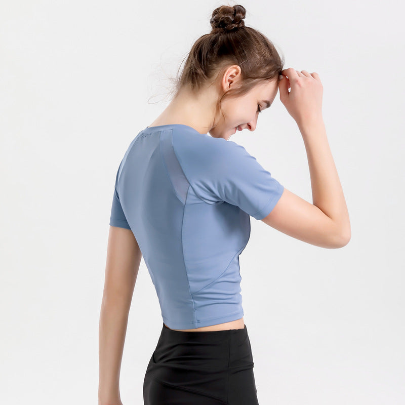 L'usure du yoga mince à manches courtes pour femmes