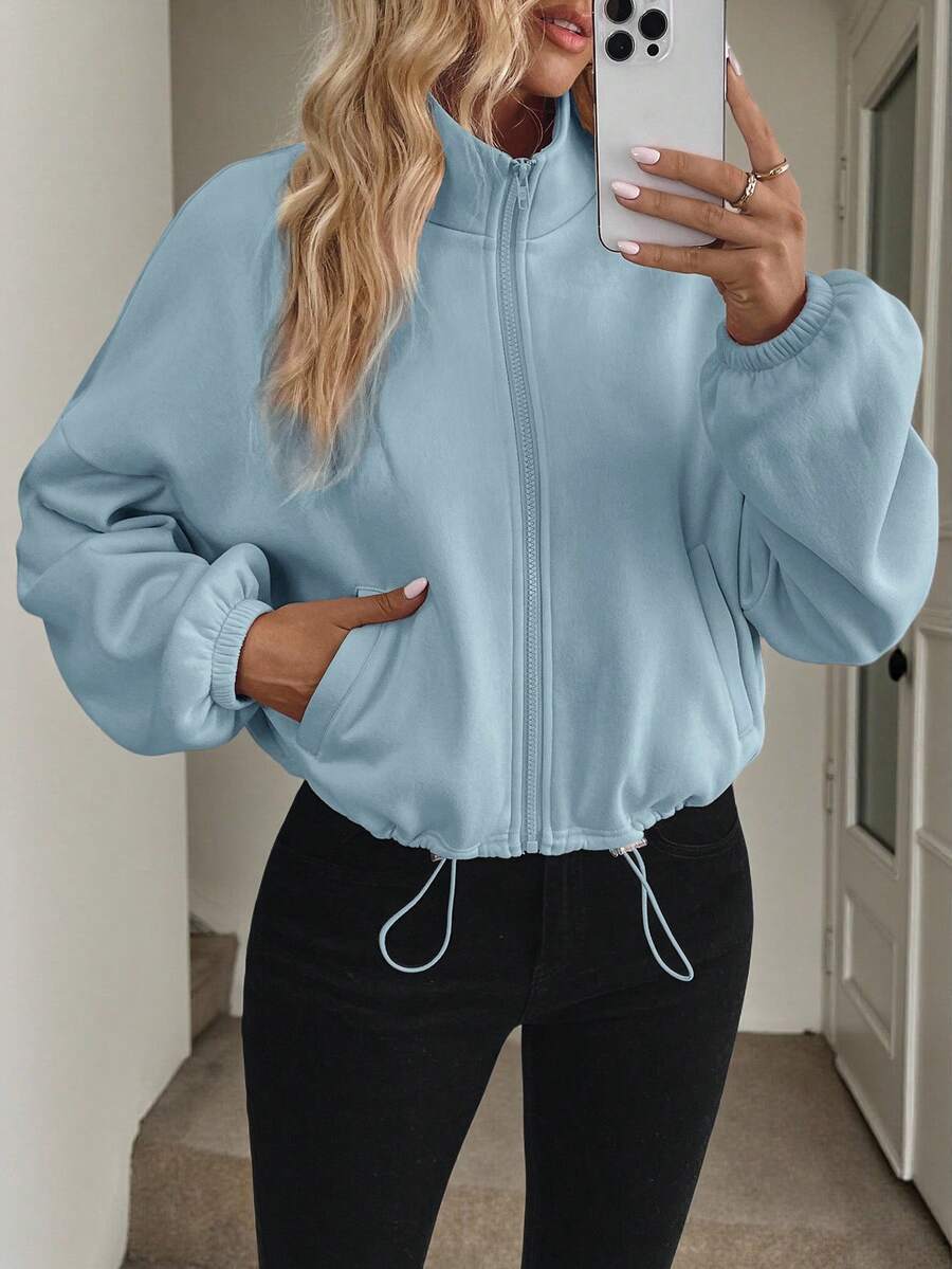 Long-sleeved jacket with drawstring and zip closure