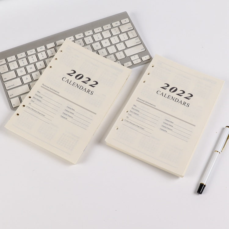 Pages intérieures de carnets à feuillets mobiles avec plan mensuel