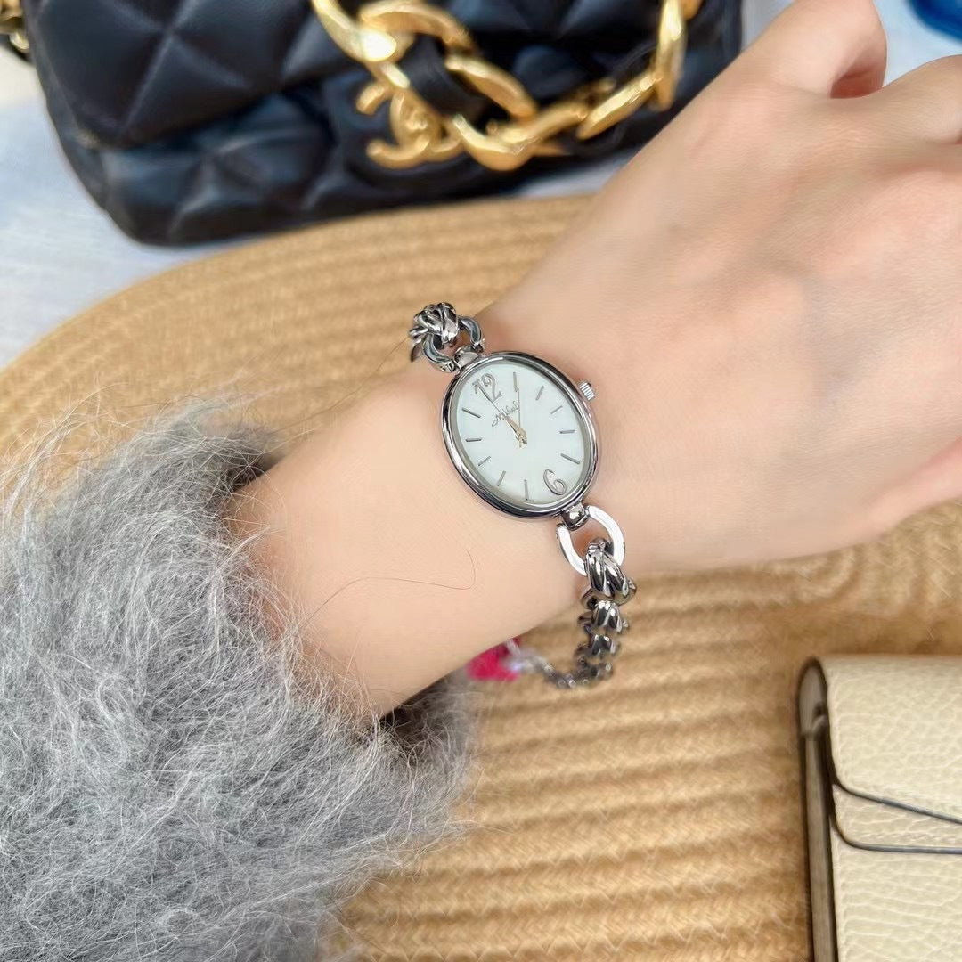 Lady's Steel Strap Watch Or Oval Hollow Chain Quartz Watch
