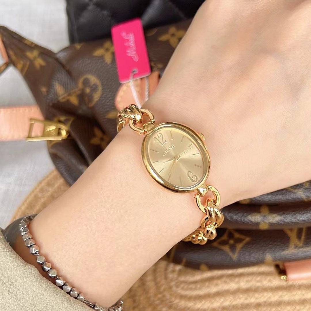 Lady's Steel Strap Watch Or Oval Hollow Chain Quartz Watch