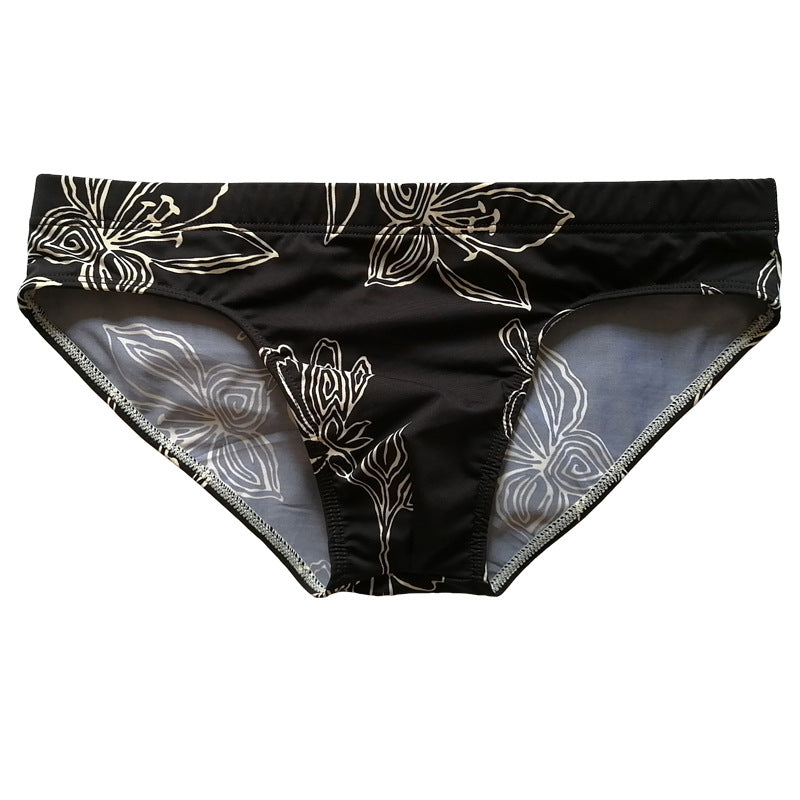 Fond noir Fleur blanche Trunks de natation simples