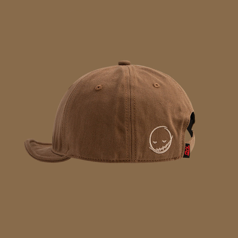 Men's and women's style Embroidered solid color Simple smile face short adjustable brim