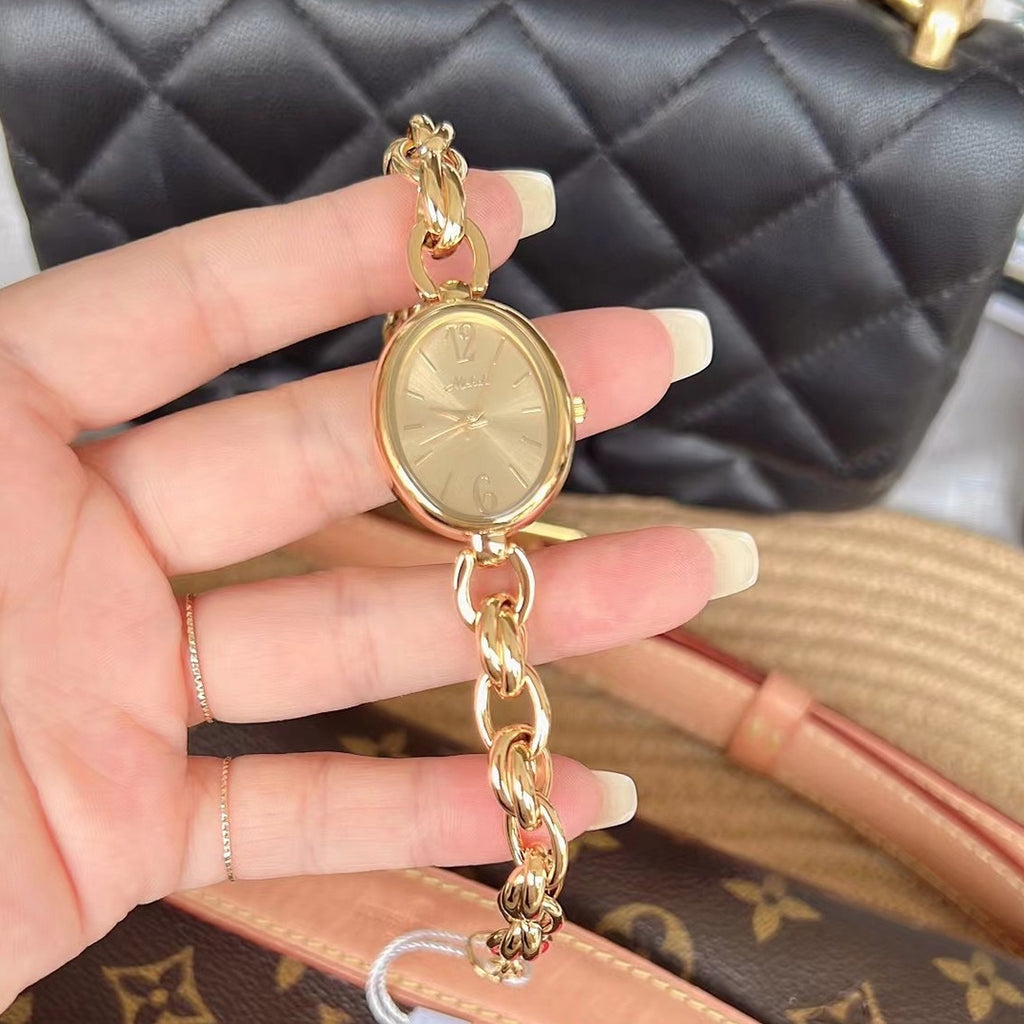 Lady's Steel Strap Watch Or Oval Hollow Chain Quartz Watch