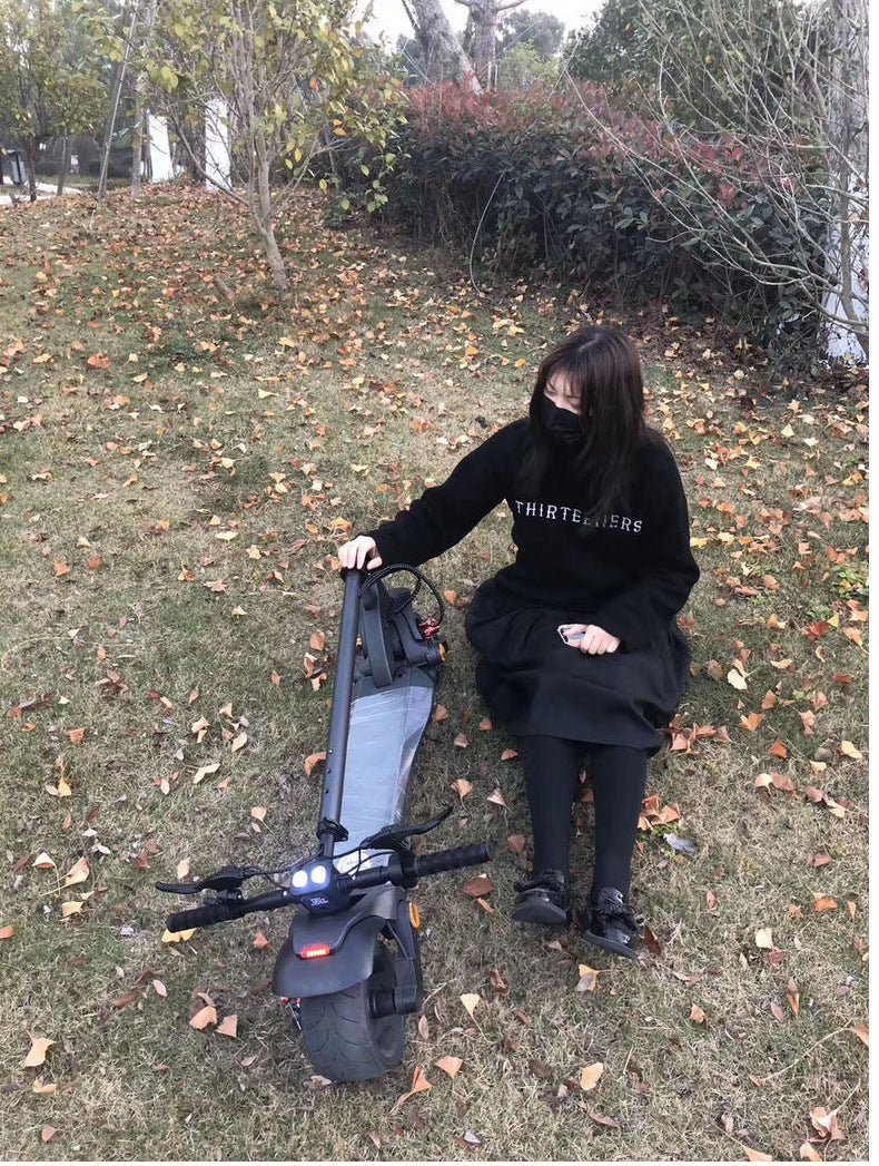 Scooter pliant double disque avec pneus larges