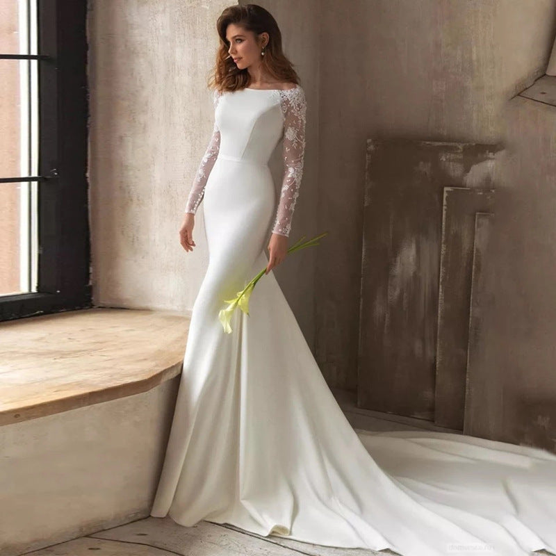 Robe de mariée en dentelle satinée à manches longues