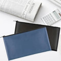 Sac de rangement minimaliste de poche zippée en cuir