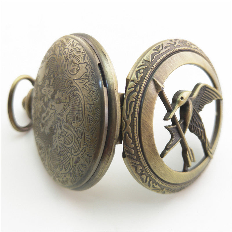 Vieille montre de poche fléchée aux gros oiseaux