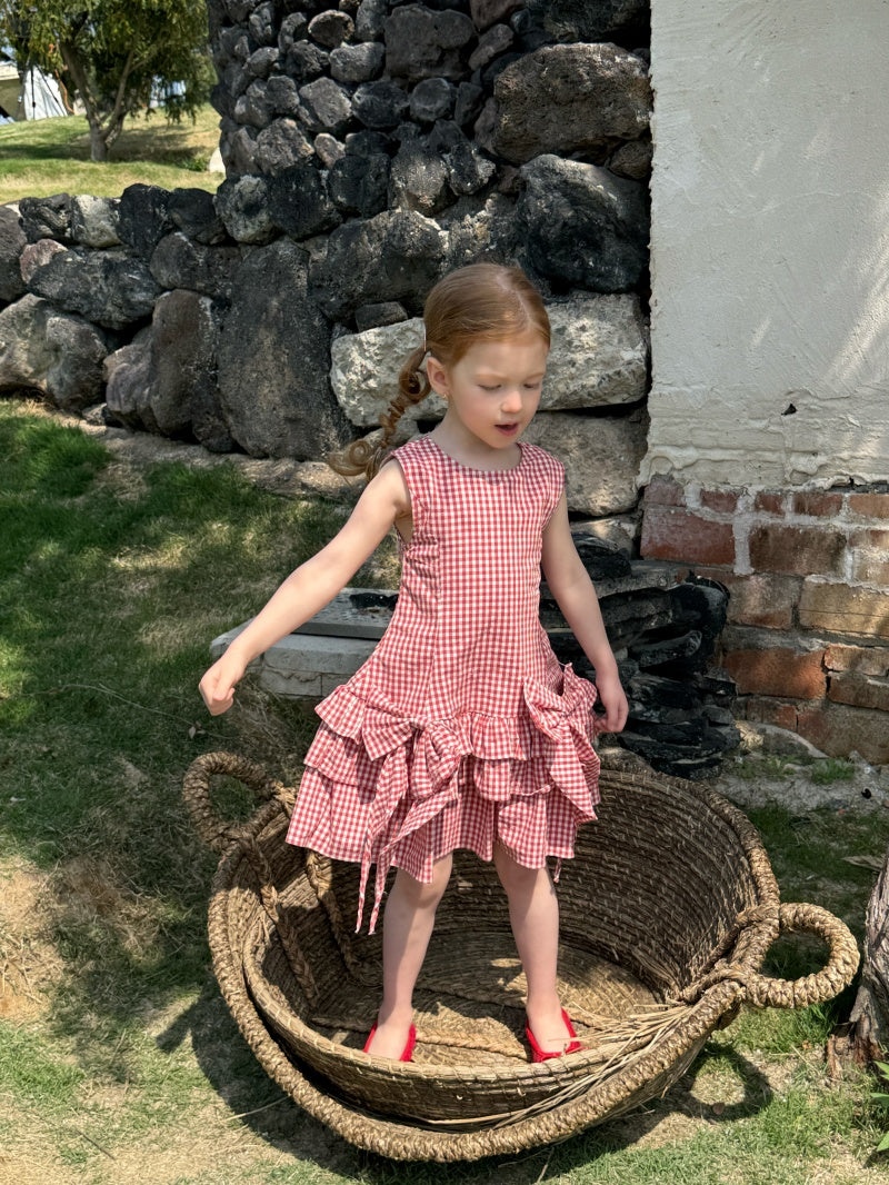 Robe à carreaux sans manches de fille avec arc rouge et jupe à manches multiples