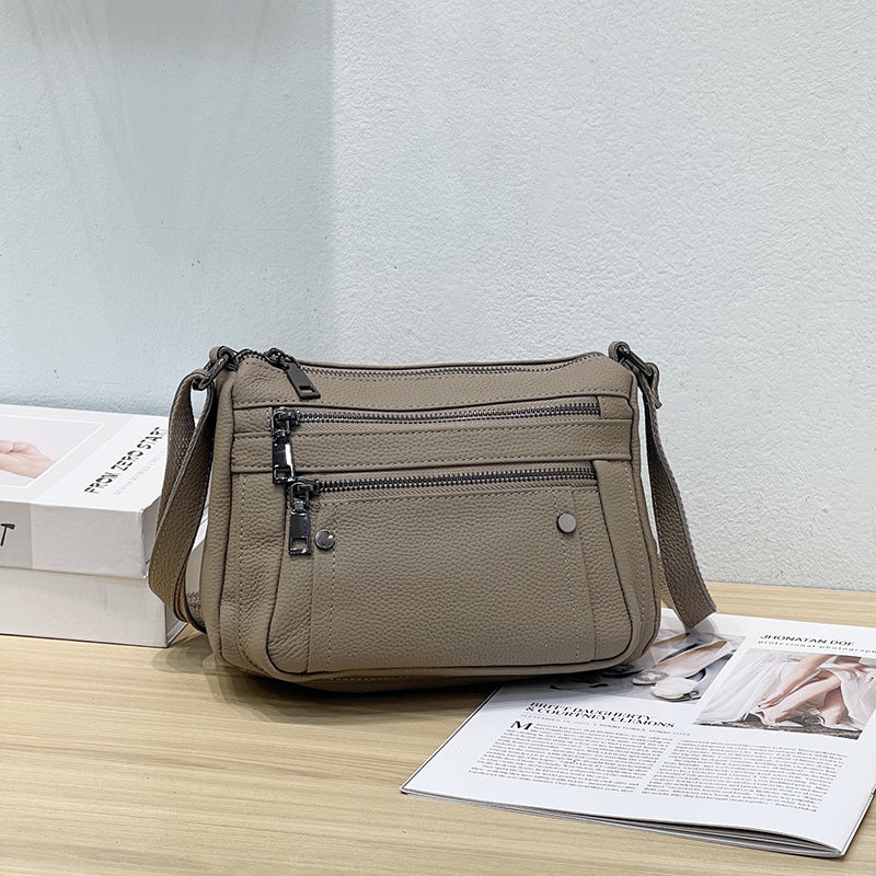 Sac à main en cuir de vache avec bande transversale en cuir véritable