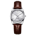 Montre de mode femme avec une véritable bracelet en cuir et un mouvement de quartz lumineux