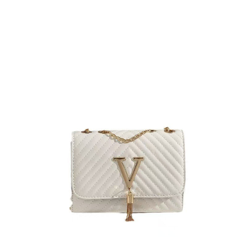 Un sac tendance pour femmes avec un corps rayé et un design floral