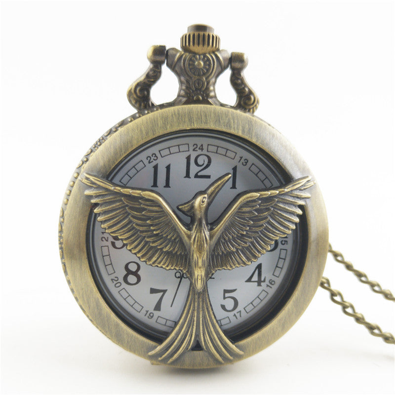 Vieille montre de poche fléchée aux gros oiseaux
