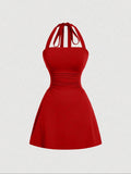Robe de sangle spaghetti sans dos en tissu plissé couleur solide pour femme