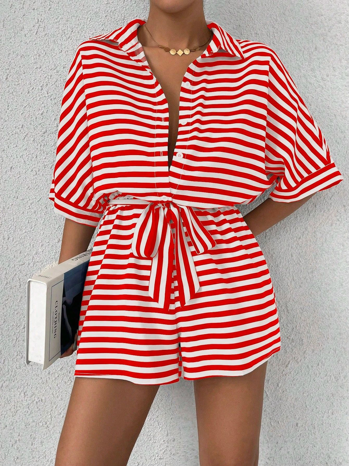 Striped summer jumpsuit featuring a lapel collar, button-front cardigan style