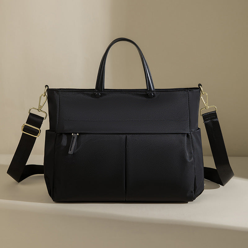 La mallette portable femme de mode grande capacité